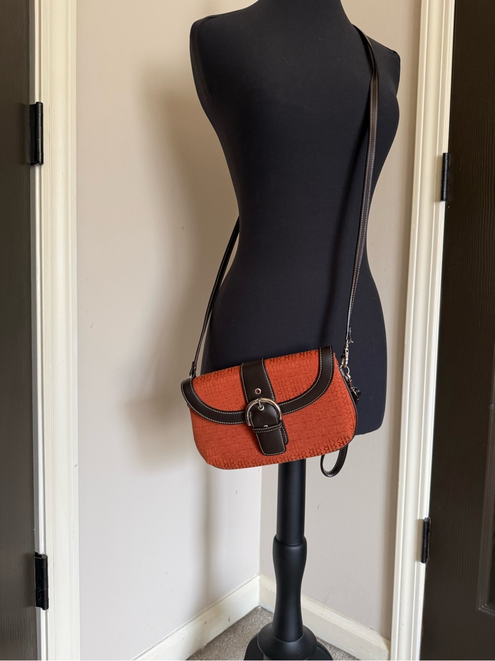 Textured Orange Crossbody Bag with Dark Trim and Buckle Detail